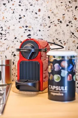 a toaster and a can of soup on a table at VFH La Rada Apartments in Santa Flavia