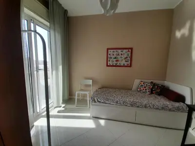 a small bedroom with a bed and a window at La stanza del buonriposo in Palermo