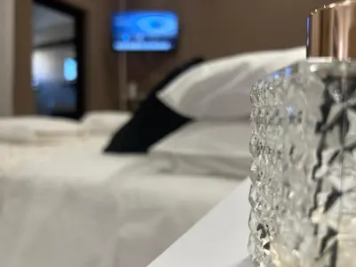 a clear glass vase sitting on a table at Suite del Corso in Ficarazzi