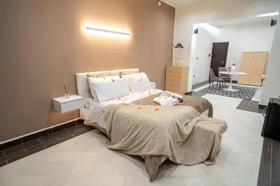 a bedroom with a bed with a stuffed animal on it at Suite del Corso in Ficarazzi