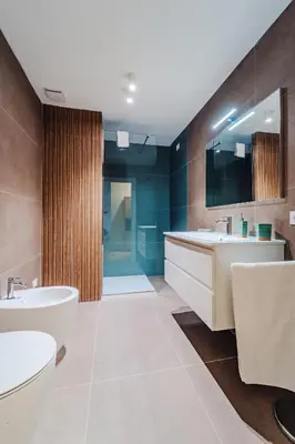 a bathroom with two sinks and a large mirror at Sofia's House - Comfort e Relax vicino Stazione Notarbartolo in Palermo
