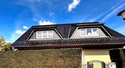 a house with a black roof at Appartamento Calabris in Bagheria
