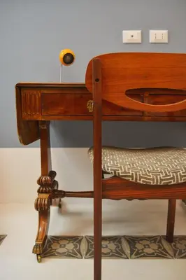 a wooden bunk bed with a desk on it at Galleria Cutò - Art Boutique Rooms in Palermo