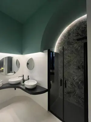 a bathroom with two sinks and a shower at Galleria Cutò - Art Boutique Rooms in Palermo