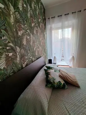 a bedroom with a bed with two pillows on it at Casa Marite' in Palermo