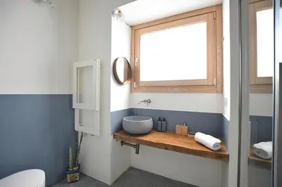 a bathroom with a sink and a mirror on a shelf at iFlat Casa di Design nella piazzetta in Palermo