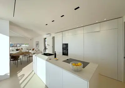 a kitchen with white cabinets and a bowl of fruit on a counter at Solemar Sicilia - Villa Gloria in Ficarazzi