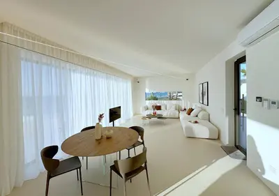 a living room with a wooden table and chairs at Solemar Sicilia - Villa Gloria in Ficarazzi
