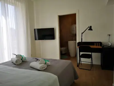 a bedroom with a bed with towels on it at Cielo D'Alcamo Palazzo Mazzini in Alcamo