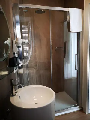 a bathroom with a shower with a sink and a shower at Cielo D'Alcamo Palazzo Mazzini in Alcamo