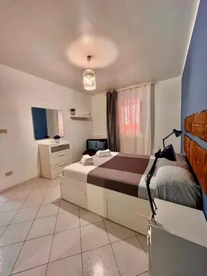 a bedroom with a large bed in a room at Scala Dei Normanni in Palermo