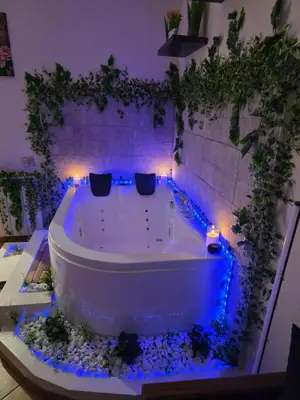 a bath tub with blue lights in a room at Monreale Prestige Rooms B&B in Monreale