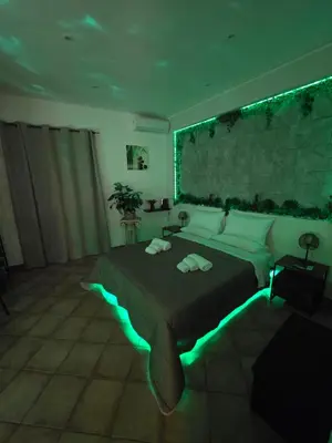 a bedroom with a large bed with lights on it at Monreale Prestige Rooms B&B in Monreale