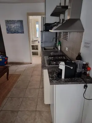 a kitchen with a stove and a counter top at Goodnight Palermo in Palermo