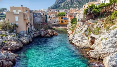 a view of a river in a city with buildings at Vicolo a Mare in Porticello