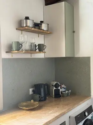 a kitchen with a sink and a washing machine at Le case del Cardinale, La casetta di nonna Elvira in Palermo