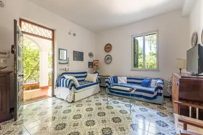 a living room with two couches and a window at Isola delle Femmine Apartments by Wonderful Italy in Isola delle Femmine