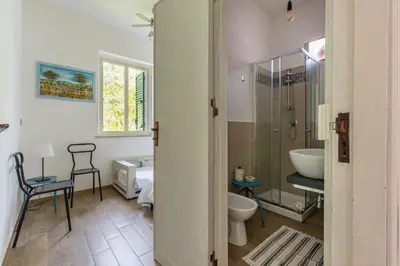 a bathroom with a toilet and a sink at Isola delle Femmine Apartments by Wonderful Italy in Isola delle Femmine