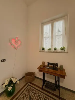 a hallway with a table with plants and a mirror at Urban Space 49 in Palermo