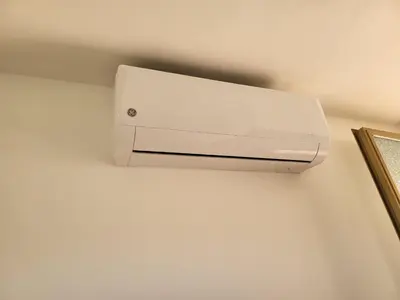 a white wall mounted air conditioner on a wall at Le Case di Sole San Vito Lo Capo in San Vito lo Capo