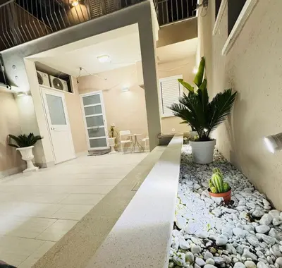 a lobby of a house with rocks and plants at Ciuri D'Amuri in Palermo