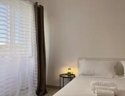 a bedroom with a bed and a window at Palermo central stay in Palermo