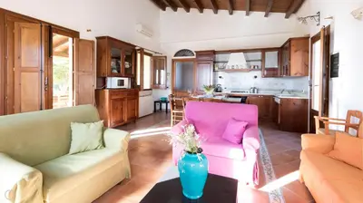 a living room with two couches and a vase on a table at Visitsicilia Villa Cialoma in Scopello