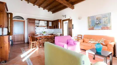 a living room with a couch and a table at Visitsicilia Villa Cialoma in Scopello