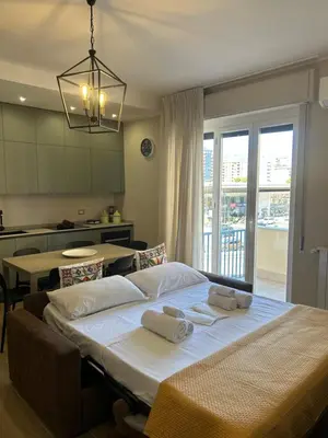 a bedroom with a large bed with towels on it at Notarbartolo Casa Centrale in Palermo
