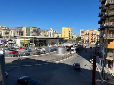 a busy city street with cars and a bus at Notarbartolo Casa Centrale in Palermo