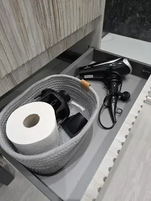 a box with a roll of toilet paper on a counter at La Mantia Luxury Rooms in Palermo
