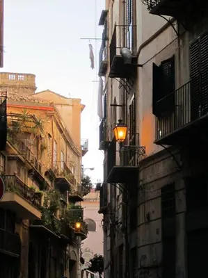 a city street with buildings and a street light at Casa Colorata in Palermo