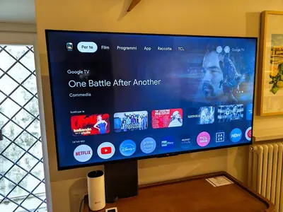 a large flat screen tv on a wall at Palazzo Castrone, Luxury Apartment in Palermo