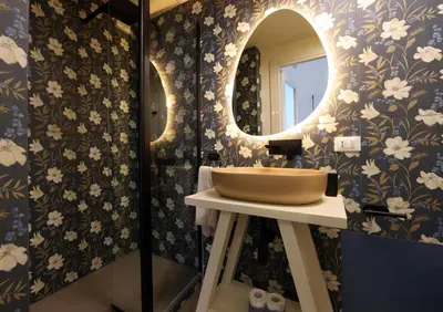 a bathroom with a sink and a mirror at Cupola Verde Rooms in Palermo