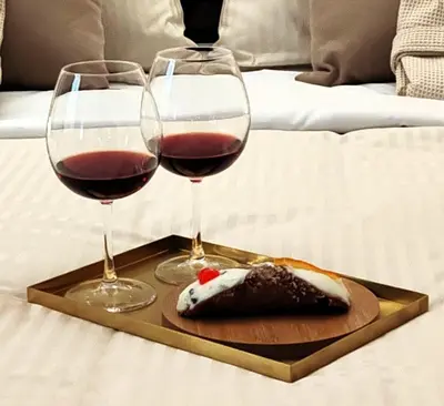 two glasses of wine and a plate of food at Sikelia House - Comfort Apartment in Palermo