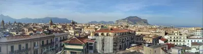 a view of a city with mountains in the background at Montesanto in Palermo