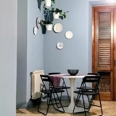 a dining room with a table and chairs at BallarHòme 105 