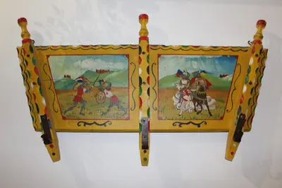 a picture frame with paintings on it on a wall at Giacalone15 - EXCLUSIVE APARTMENT IN THE HISTORIC CENTER NEAR THE TEATRO MASSIMO in Palermo