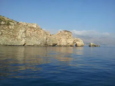 a view of a large body of water with rocks at La Casetta nel Porto in Castellammare del Golfo
