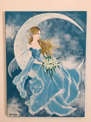a painting of a woman sitting on the moon at B&B Selene in San Vito lo Capo