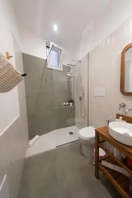 a bathroom with a shower and a toilet and a sink at A casa da Carlo al Borgo 2 in Palermo