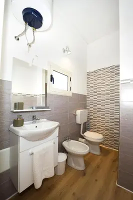 a bathroom with a sink and a toilet at Affittacamere le scale in Castellammare del Golfo