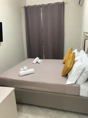 a bedroom with a bed with towels on it at Isti e Binisti Flat in Palermo