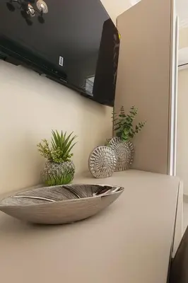 a bowl on a counter with potted plants on it at Kalaciuri Rooms in Palermo