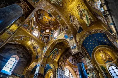 a church with ornate ceilings and mosaics at Kalaciuri Rooms in Palermo
