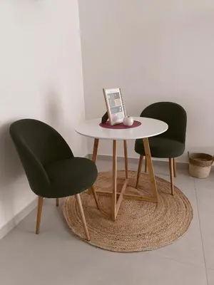 two chairs and a table with a laptop on it at SulCorsoRooms in Palermo