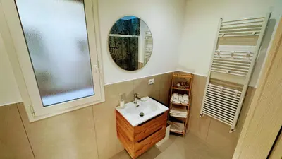 a bathroom with a sink and a mirror at SulCorsoRooms in Palermo
