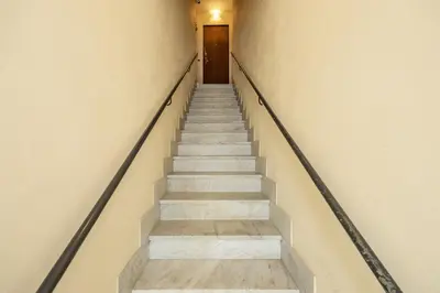 a stairway leading up to a door in a building at Mama apt - Comfort & style in Partanna Mondello in Palermo