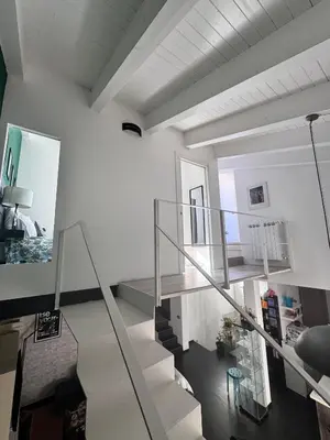 a staircase in a room with white walls at Dimora Stella Boutique in Alcamo