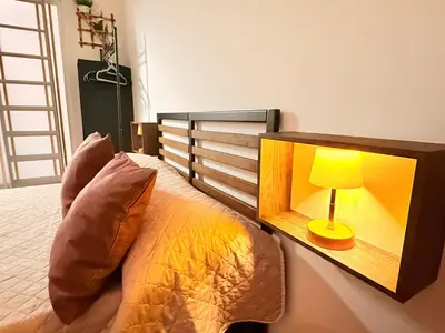 a bedroom with a bed with a lamp on it at La Casetta del Centro in Palermo